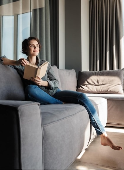 A customer sits in her home that she financed with CLARK